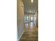 Entryway featuring wood-look floors, neutral paint, double glass doors, and natural light at 10218 Arctic Edge Dr, Indianapolis, IN 46259