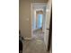 Hallway featuring neutral paint, plush carpet, modern doors, and stylish tiling at 10218 Arctic Edge Dr, Indianapolis, IN 46259