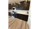 Kitchen with a gas range, stainless steel appliances, white subway tile backsplash, and dark cabinetry at 10218 Arctic Edge Dr, Indianapolis, IN 46259