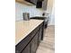 Modern kitchen showcasing quartz countertops, gas range, stainless steel appliances, and dark wood cabinets at 10218 Arctic Edge Dr, Indianapolis, IN 46259