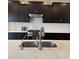 Kitchen with a gas range, stainless steel appliances, white countertops, and dark cabinetry at 10218 Arctic Edge Dr, Indianapolis, IN 46259