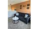 Comfortable living room with dark couch, round table, and an orange accent wall at 10218 Arctic Edge Dr, Indianapolis, IN 46259