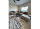 Comfortable living room featuring a plush sectional sofa, stylish rug, and a modern coffee table at 10218 Arctic Edge Dr, Indianapolis, IN 46259