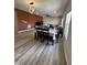 Spacious living space features an open floor plan, dining area, modern lighting, and cozy seating at 10218 Arctic Edge Dr, Indianapolis, IN 46259