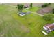 Aerial view of the property with a home surrounded by grass and crops and rural surroundings at 10500 S County Road 200 W, Muncie, IN 47302