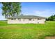 Home exterior featuring a well-maintained lawn and a peaceful country setting at 10500 S County Road 200 W, Muncie, IN 47302