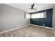 Comfortable bedroom with gray walls, wood-look floors, and natural light from the window at 10500 S County Road 200 W, Muncie, IN 47302