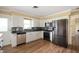Well-lit kitchen featuring stainless steel appliances, modern cabinetry, and a stylish backsplash at 10500 S County Road 200 W, Muncie, IN 47302