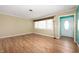Bright room with wood floors, a large window, and freshly painted white trim at 10500 S County Road 200 W, Muncie, IN 47302