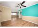 Spacious living area with wood floors, a ceiling fan, and neutral wall colors at 10500 S County Road 200 W, Muncie, IN 47302