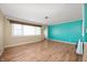 Spacious, bright living room featuring wood-look floors and fresh paint at 10500 S County Road 200 W, Muncie, IN 47302