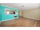 Open living area featuring wood-look floors and access to the kitchen space at 10500 S County Road 200 W, Muncie, IN 47302