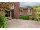 Enjoy this backyard featuring a patio, lush landscaping, and a brick exterior at 11074 Galley Way, Fishers, IN 46040