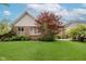 Well-maintained brick house backyard with lush green lawn and healthy landscaping at 11074 Galley Way, Fishers, IN 46040