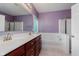 Well-lit bathroom with double sinks, bathtub and shower at 11074 Galley Way, Fishers, IN 46040