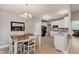 Open dining area featuring hardwood floors and white table and chairs at 11074 Galley Way, Fishers, IN 46040