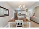 Open dining area with view to the kitchen and living room at 11074 Galley Way, Fishers, IN 46040