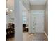 This home's foyer features a front door, a small area rug, and hardwood floors at 11074 Galley Way, Fishers, IN 46040
