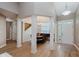Bright foyer featuring an elegant staircase, natural light, and an adjacent dining area at 11074 Galley Way, Fishers, IN 46040