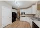 Well-lit kitchen features white cabinetry, stainless steel appliances, and durable countertops at 11074 Galley Way, Fishers, IN 46040