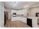 Well-lit kitchen features white cabinetry, stainless steel appliances, and durable countertops at 11074 Galley Way, Fishers, IN 46040