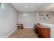 Home office with wooden desk, small window and light colored flooring, walls and recessed lighting at 11074 Galley Way, Fishers, IN 46040