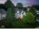 Stunning aerial view of a white two-story home surrounded by lush greenery at 12450 Petalon Trce, Fishers, IN 46037