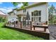 Backyard deck area with outdoor seating, grill, and lovely backyard view at 12450 Petalon Trce, Fishers, IN 46037