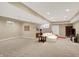 Expansive finished basement with plush carpet, recessed lights, and versatile layout at 12450 Petalon Trce, Fishers, IN 46037