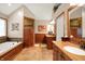 Elegant bathroom with a large tub, wooden paneling and double vanity with plenty of space at 12450 Petalon Trce, Fishers, IN 46037