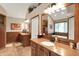 Elegant bathroom featuring wood cabinets, double mirrors and a tub with plenty of space at 12450 Petalon Trce, Fishers, IN 46037