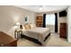 Comfortable bedroom featuring neutral tones, a ceiling fan, and a window for natural light at 12450 Petalon Trce, Fishers, IN 46037