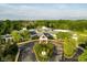 Aerial view of clubhouse entrance with a circular driveway and manicured landscaping at 12450 Petalon Trce, Fishers, IN 46037