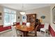 Dining room filled with light features a wood table, chairs, and china cabinet at 12450 Petalon Trce, Fishers, IN 46037
