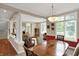 This dining room features bright windows, hardwood floors, and elegant architectural details at 12450 Petalon Trce, Fishers, IN 46037