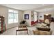Inviting living room, flooded with natural light, leads to dining area; perfect for relaxation at 12450 Petalon Trce, Fishers, IN 46037