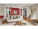 Bright living room with a staircase and columns provides an airy and welcoming atmosphere at 12450 Petalon Trce, Fishers, IN 46037