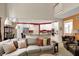 The cozy living room has seating for everyone and views of the kitchen and staircase at 12450 Petalon Trce, Fishers, IN 46037