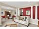 Comfortable living room with view to dining, featuring plush seating and stylish accents at 12450 Petalon Trce, Fishers, IN 46037