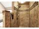 Tiled shower with a built-in niche and a rain shower head at 12450 Petalon Trce, Fishers, IN 46037