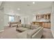 Spacious finished basement with wet bar, pool table, and comfortable seating area for entertaining at 13757 Flintridge Pass, Carmel, IN 46033