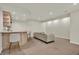 Basement bar area with seating, offering a relaxing space for drinks and socializing at 13757 Flintridge Pass, Carmel, IN 46033