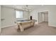 Basement recreational space featuring a pool table with modern lighting and ample room at 13757 Flintridge Pass, Carmel, IN 46033