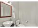 Elegant powder room featuring a modern vessel sink and a decorative mirror at 13757 Flintridge Pass, Carmel, IN 46033