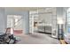 Open-concept living room featuring modern design with a view to dining area and staircase at 13757 Flintridge Pass, Carmel, IN 46033