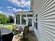 View of patio, screened porch and backyard from rear of home at 13859 Keams Dr, Fishers, IN 46038