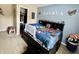 Charming bedroom with fun superhero decor and ample storage space bed at 13859 Keams Dr, Fishers, IN 46038