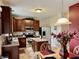 Updated kitchen features stainless appliances, wood cabinets and a kitchen island at 13859 Keams Dr, Fishers, IN 46038