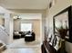 Inviting living room features neutral paint, ceiling fan, and large windows at 13859 Keams Dr, Fishers, IN 46038