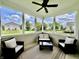 Relaxing screened porch with wicker seating and ceiling fan at 13859 Keams Dr, Fishers, IN 46038